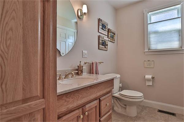 2648 Massachusetts Avenue Lexington, MA 02421 - Photo 9 of 19 a bathroom with a toilet a sink and mirror