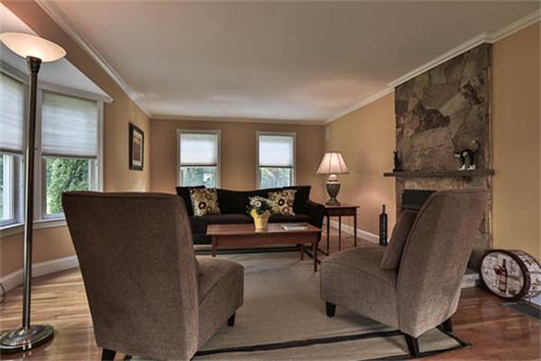 2648 Massachusetts Avenue Lexington, MA 02421 - Photo 10 of 19 a living room with furniture a window and a fireplace