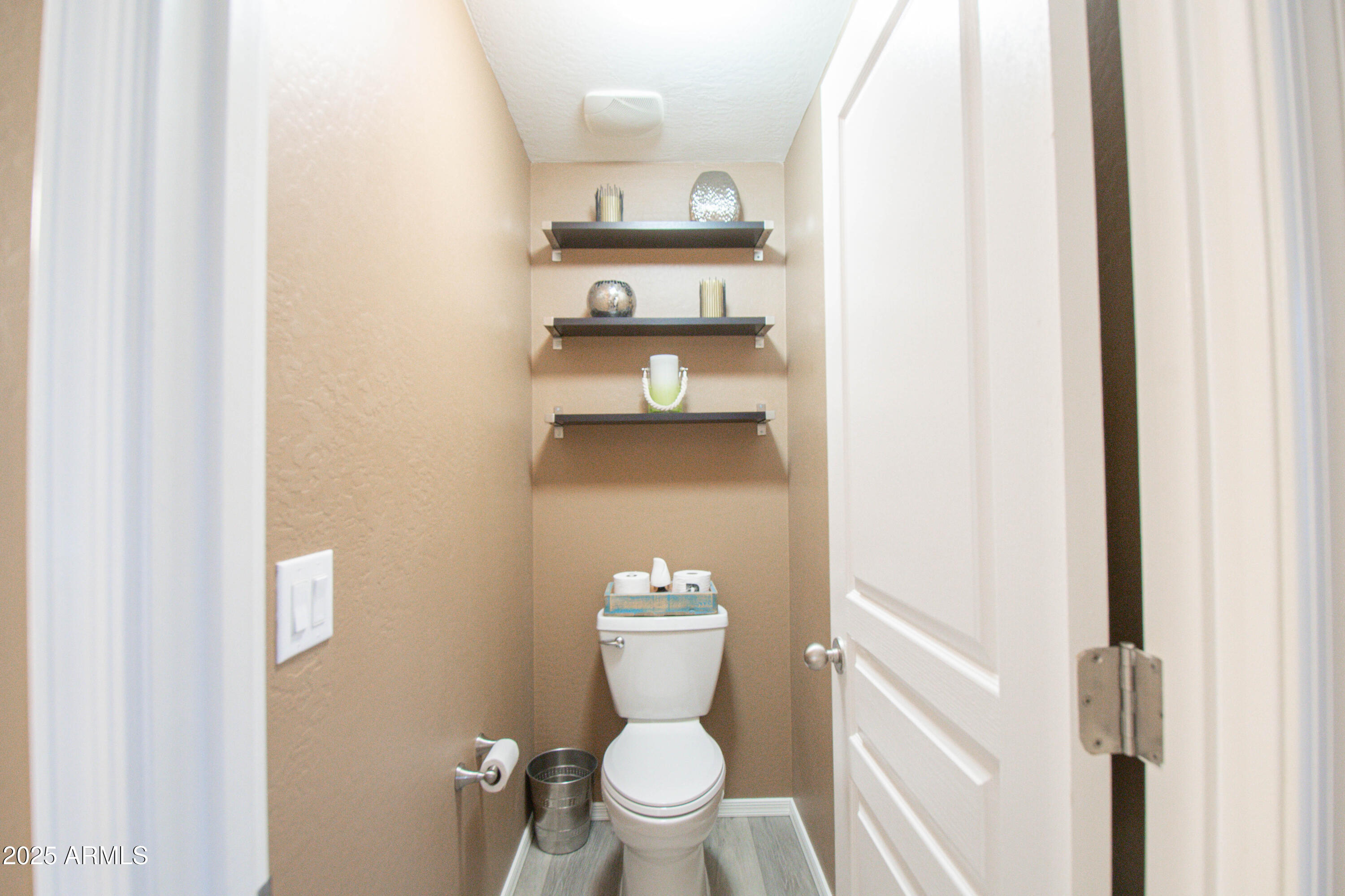 3924 South Napa Lane Gilbert, AZ 85297 - Photo 18 of 42 a bathroom with a toilet and a view of bathroom