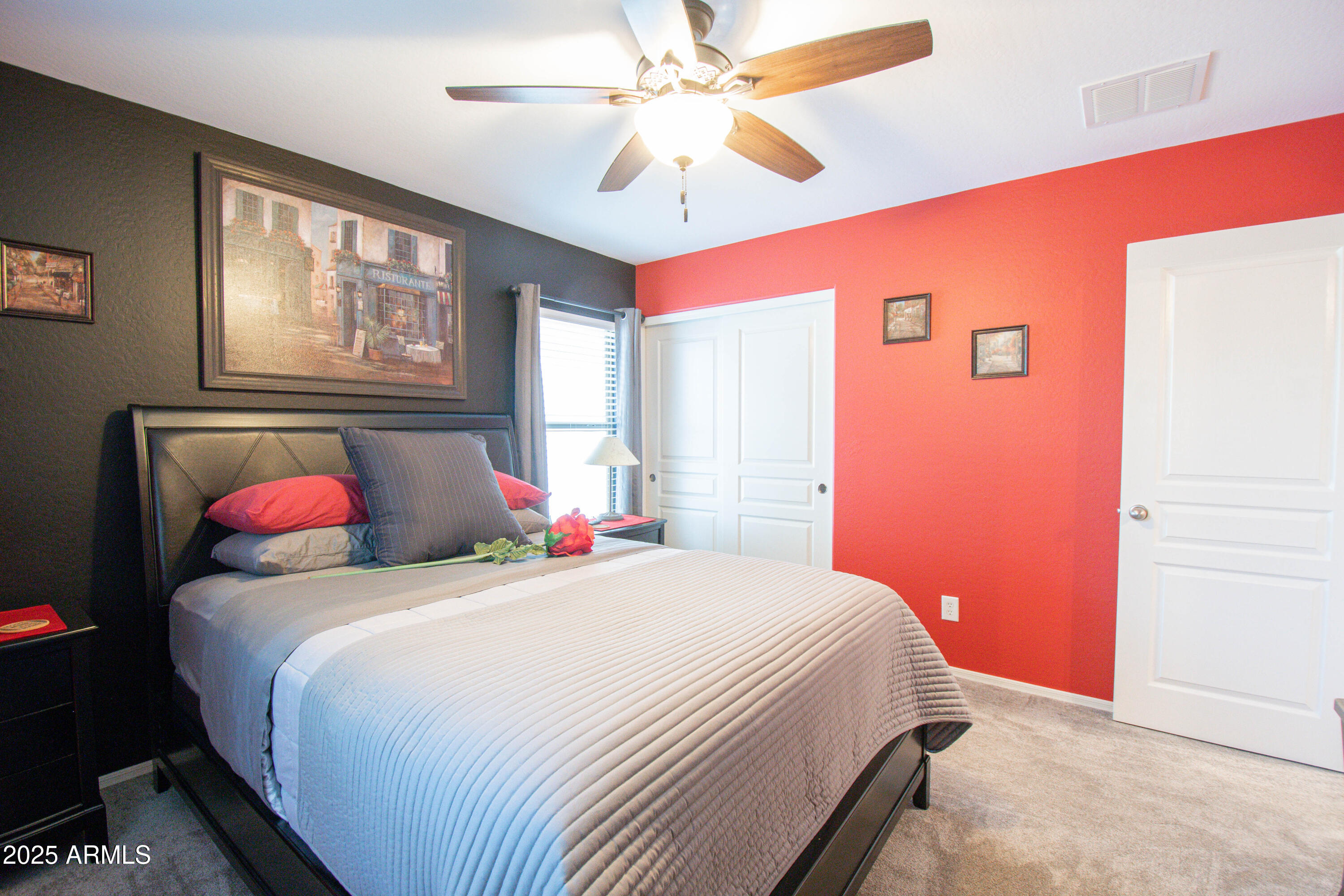 3924 South Napa Lane Gilbert, AZ 85297 - Photo 25 of 42 a bedroom with a bed and a chandelier