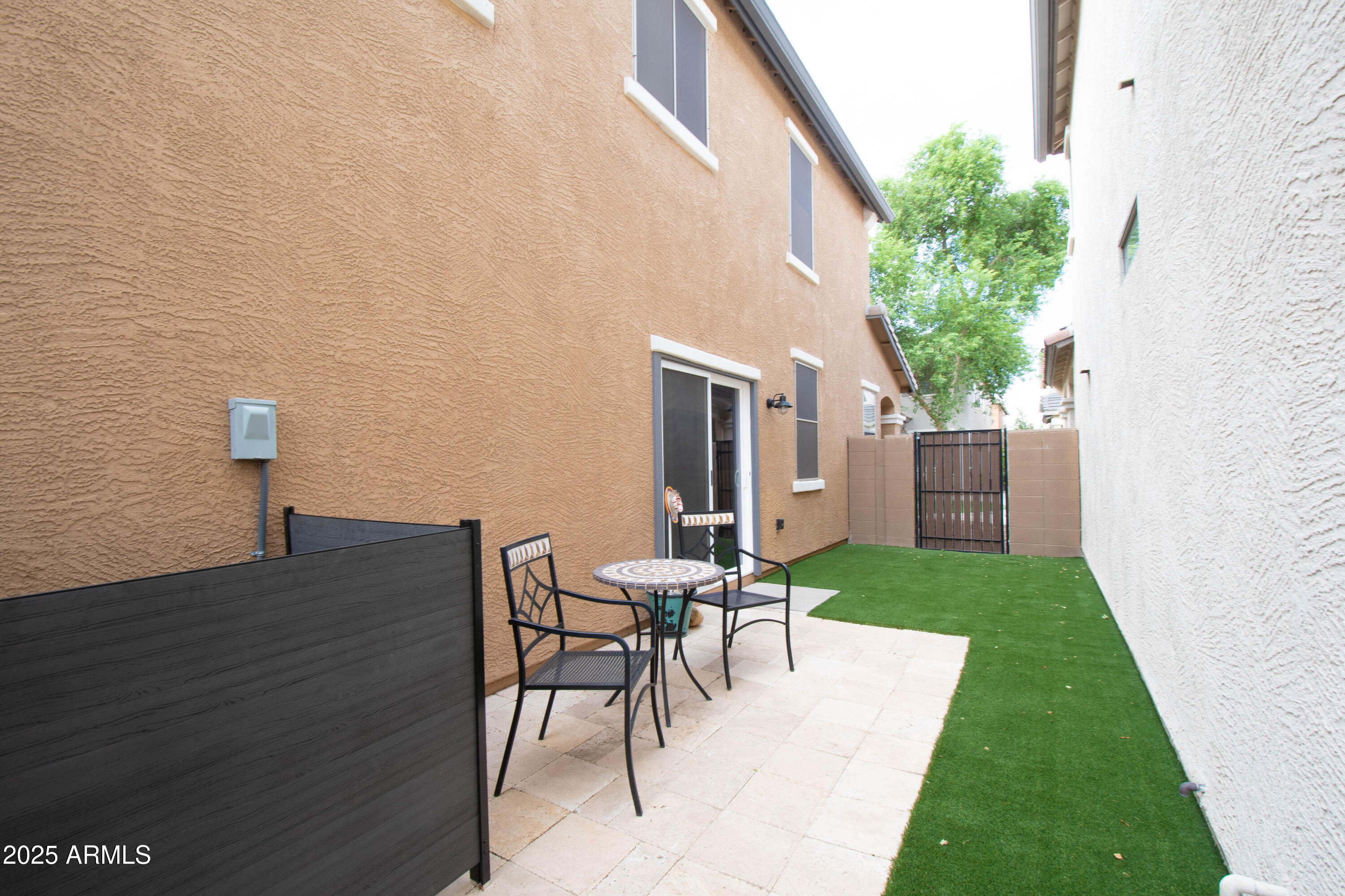 3924 South Napa Lane Gilbert, AZ 85297 - Photo 31 of 42 a view of a backyard with table and chairs and a yard