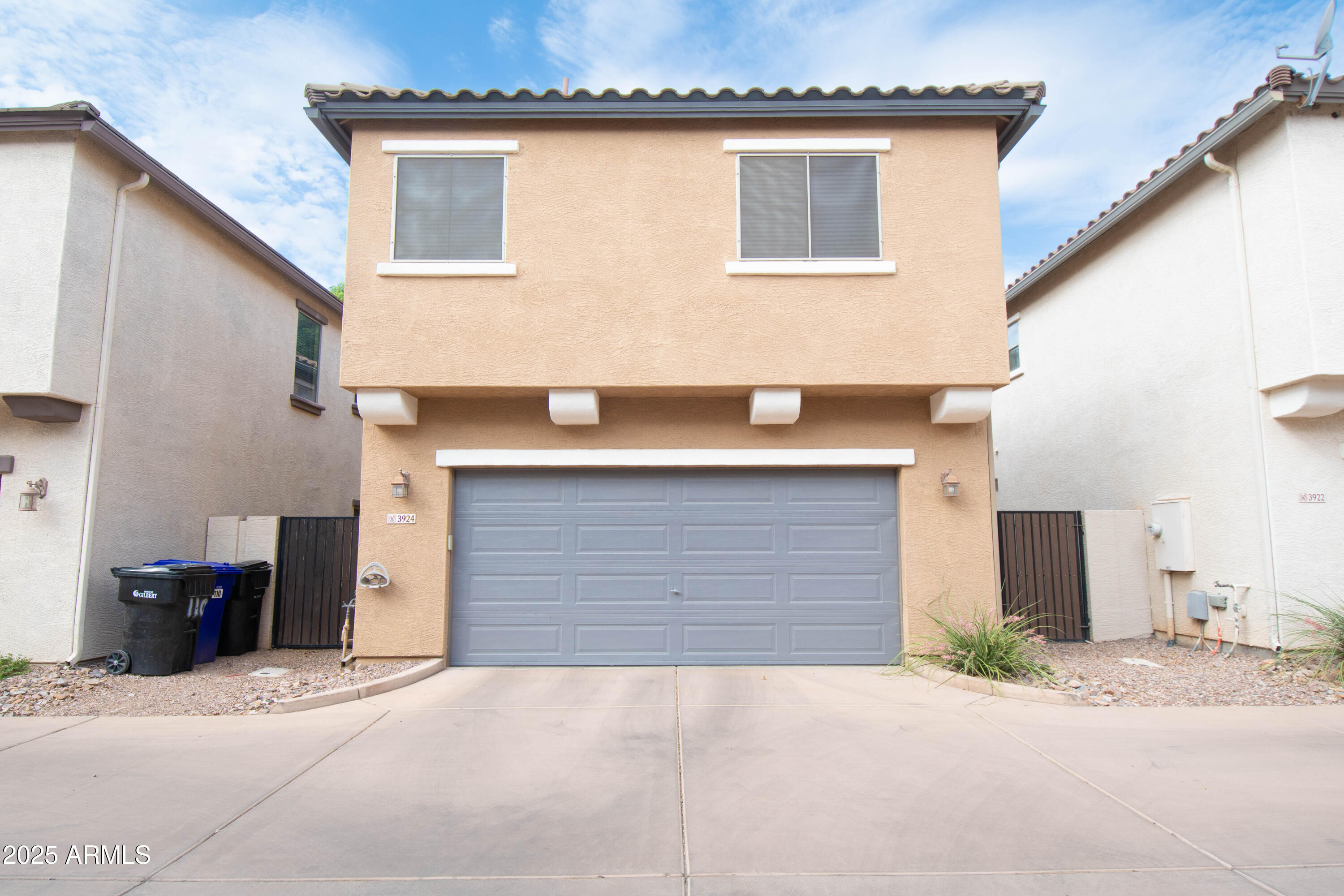 3924 South Napa Lane Gilbert, AZ 85297 - Photo 34 of 42 a front view of a house with a garage