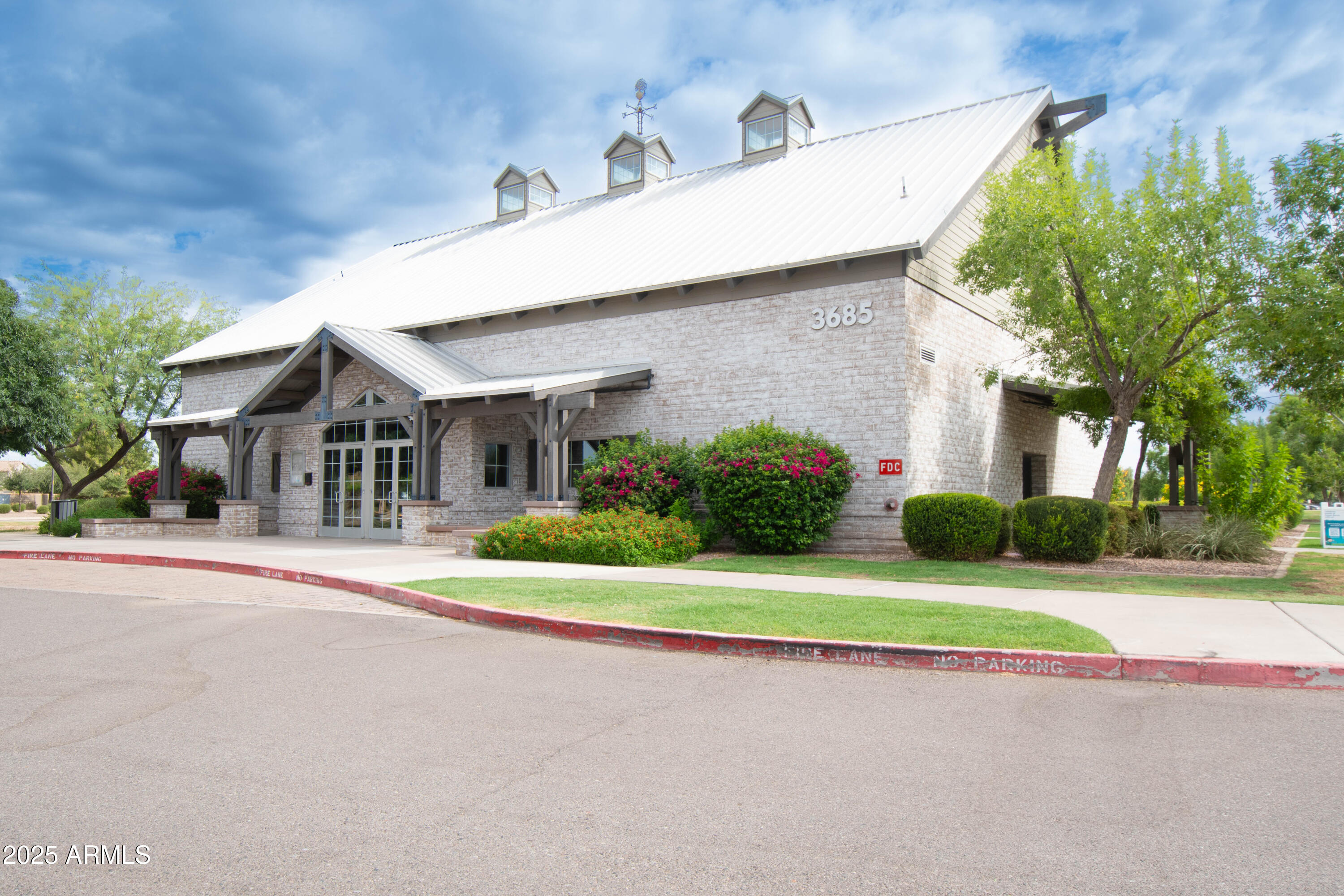 3924 South Napa Lane Gilbert, AZ 85297 - Photo 38 of 42 a front view of a house with a yard and garage