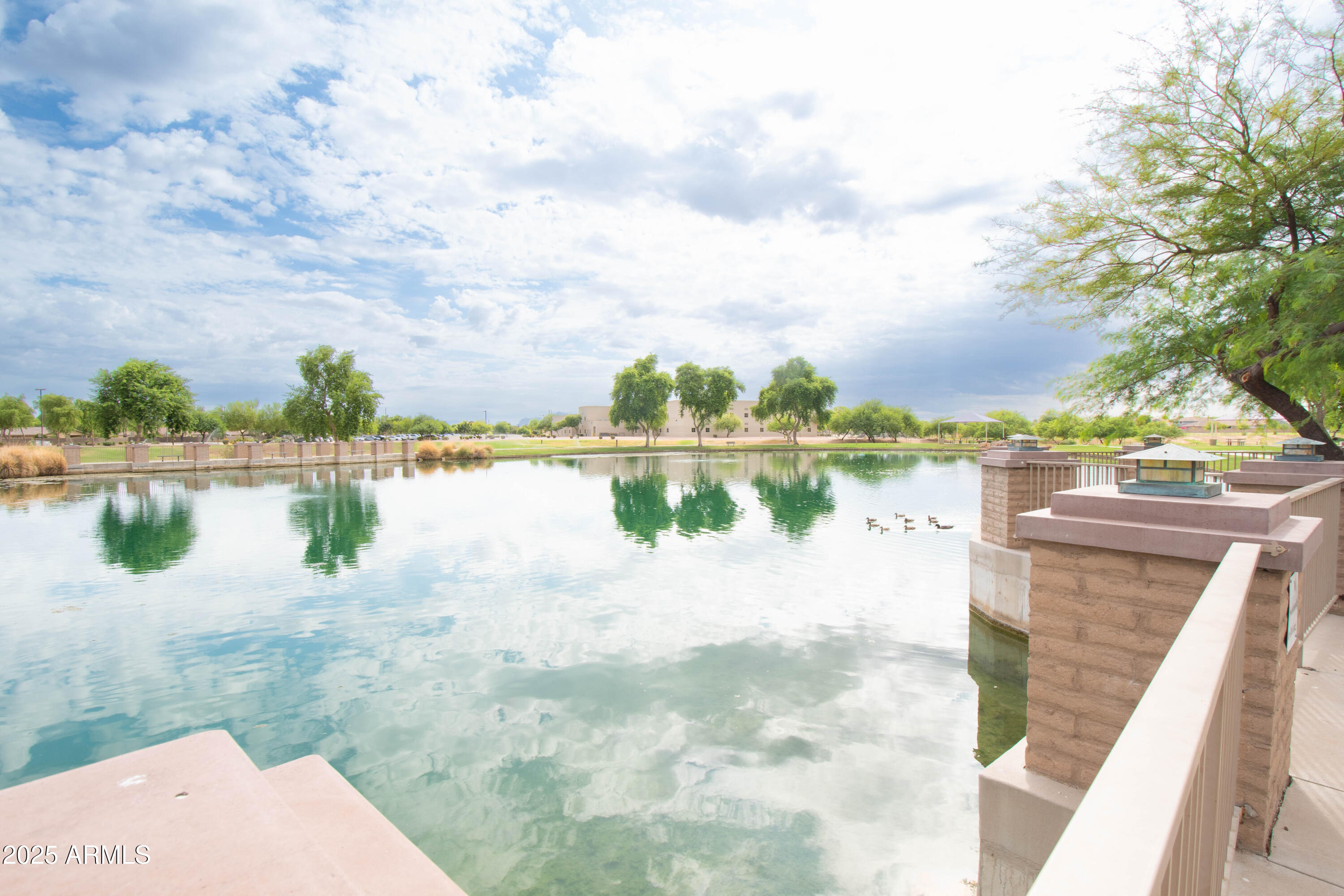3924 South Napa Lane Gilbert, AZ 85297 - Photo 42 of 42 a view of a lake with houses in the background