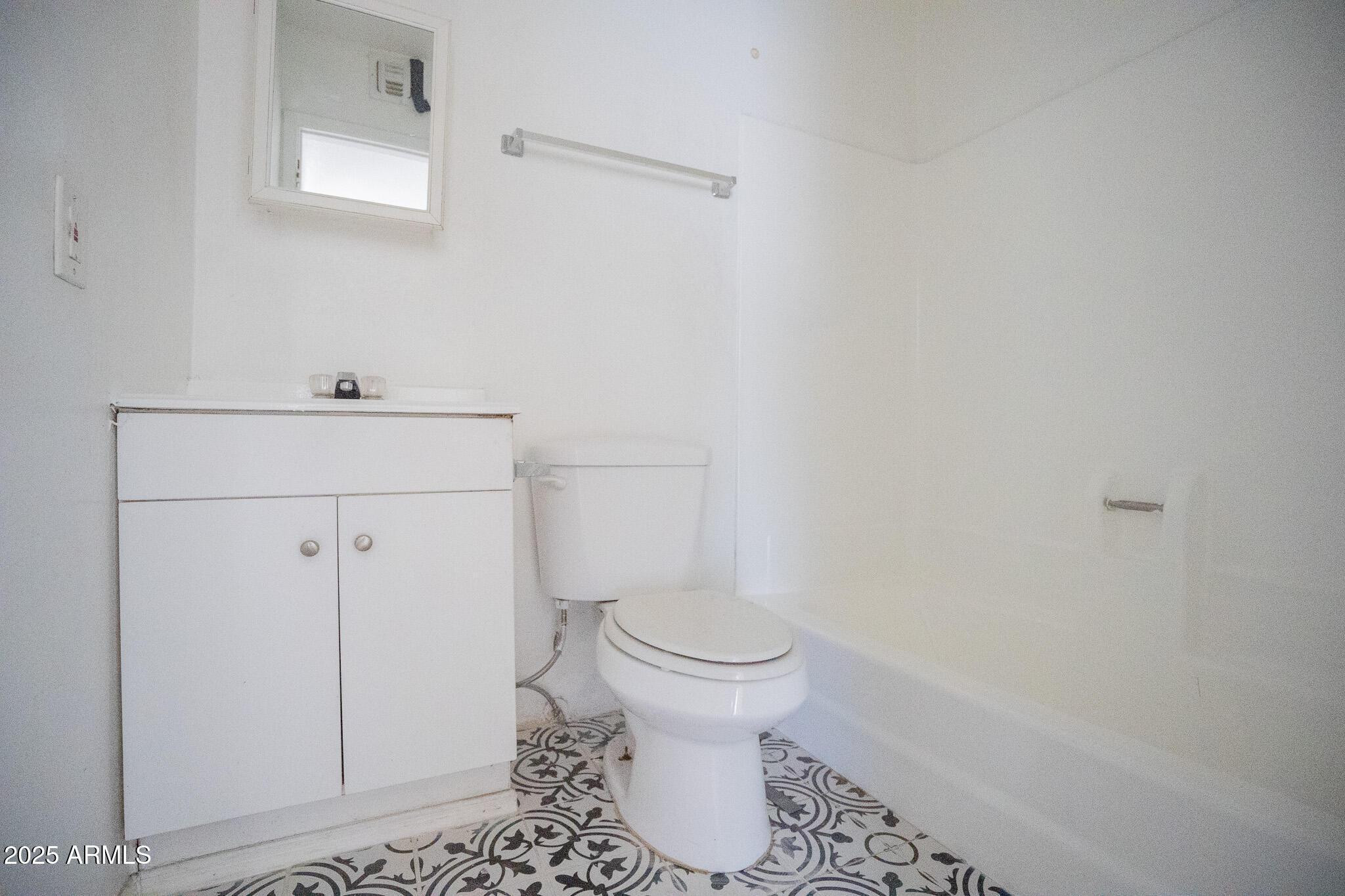 1703 West Mountain View Road, Unit 15 Phoenix, AZ 85021 - Photo 11 of 11 a bathroom with a toilet and a sink