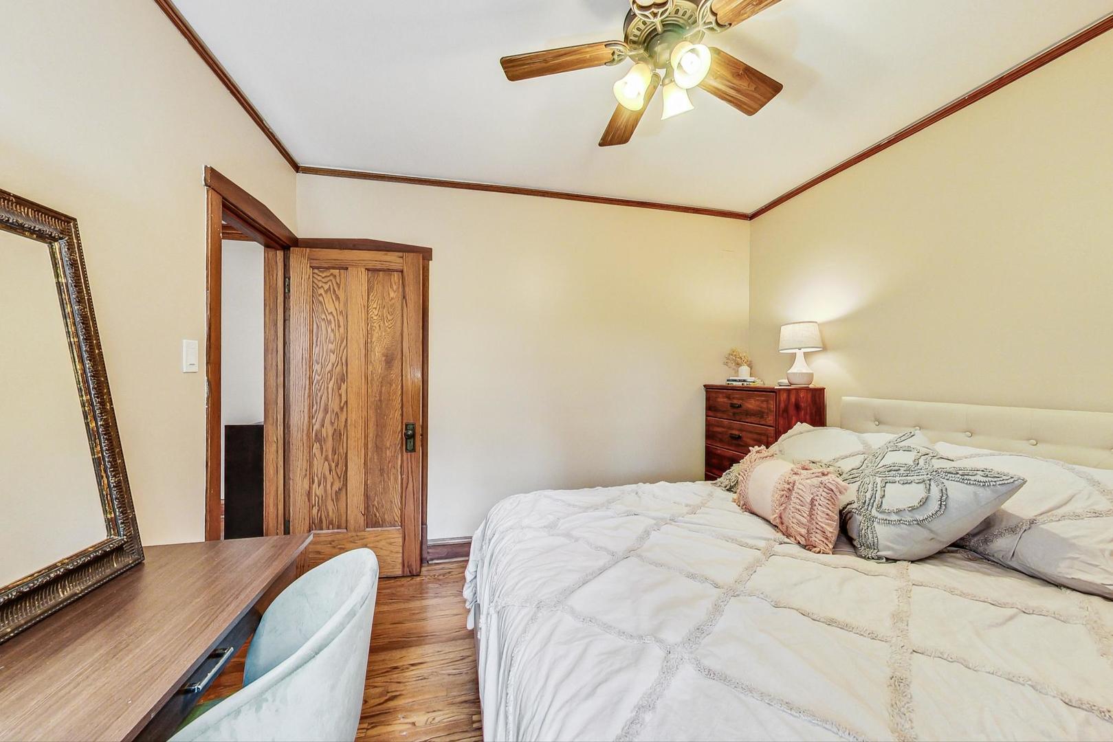 2004 West Walton Street, Unit 2B Chicago, IL 60622 - Photo 11 of 17 a bedroom with a bed and a flat screen tv