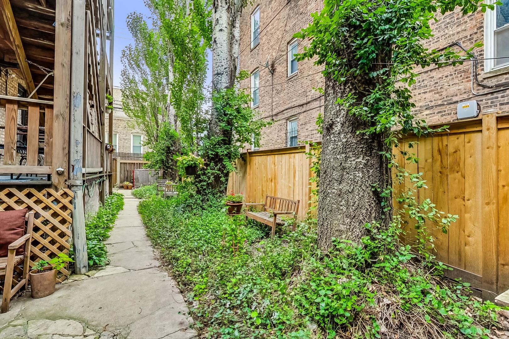 2004 West Walton Street, Unit 2B Chicago, IL 60622 - Photo 16 of 17 a view of a pathway with house on both side