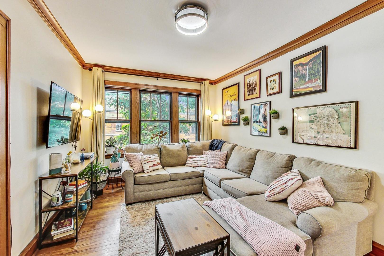 2004 West Walton Street, Unit 2B Chicago, IL 60622 - Photo 2 of 17 a living room with furniture and a flat screen tv