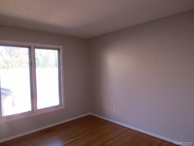 21720 River Ridge Trail Farmington, MI 48335 - Photo 16 of 31 Third Bedroom