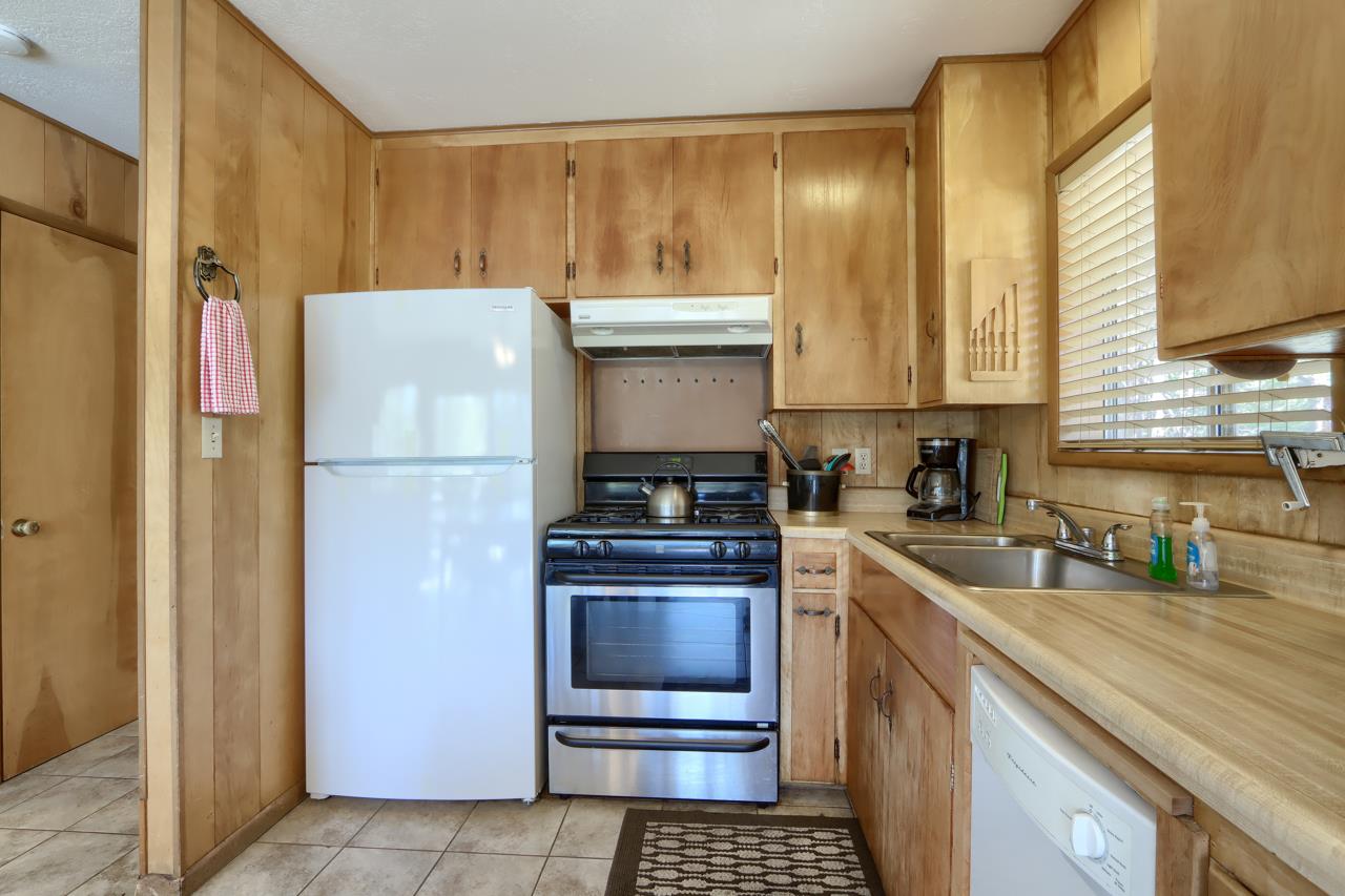 2628 West Bruce Road Wawona, CA 95389 - Photo 15 of 33 a kitchen with a refrigerator and a sink