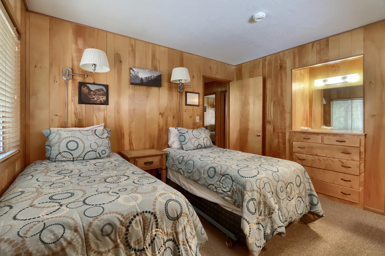 2628 West Bruce Road Wawona, CA 95389 - Photo 17 of 33 a bedroom with a bed and painting on the wall