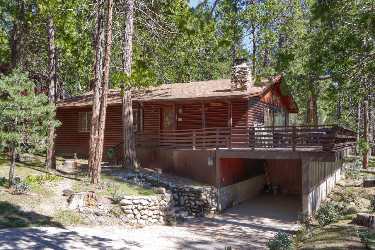 2628 West Bruce Road Wawona, CA 95389 - Photo 2 of 33 a view of house with yard outdoor seating and covered with trees