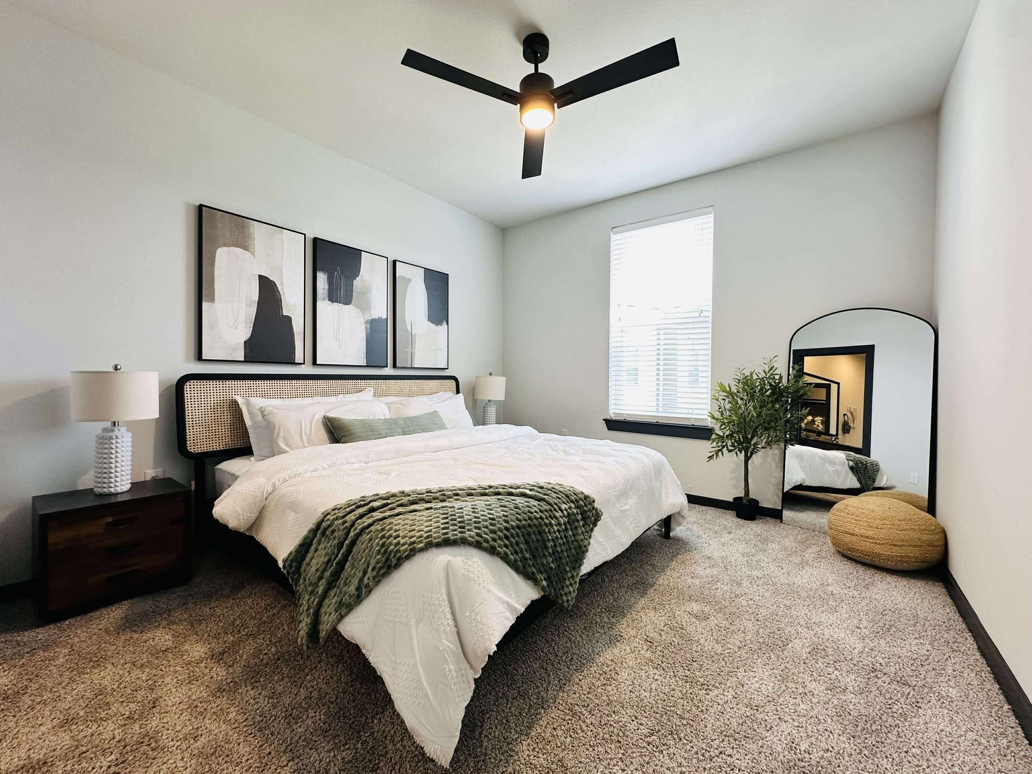 2603 North Fry Road, Unit A1 Katy, TX 77449 - Photo 11 of 13 a bedroom with bed and a chandelier