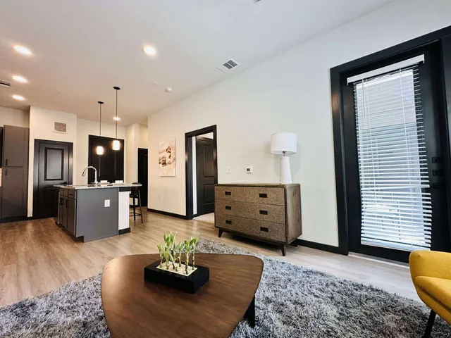 a living room with furniture and a window