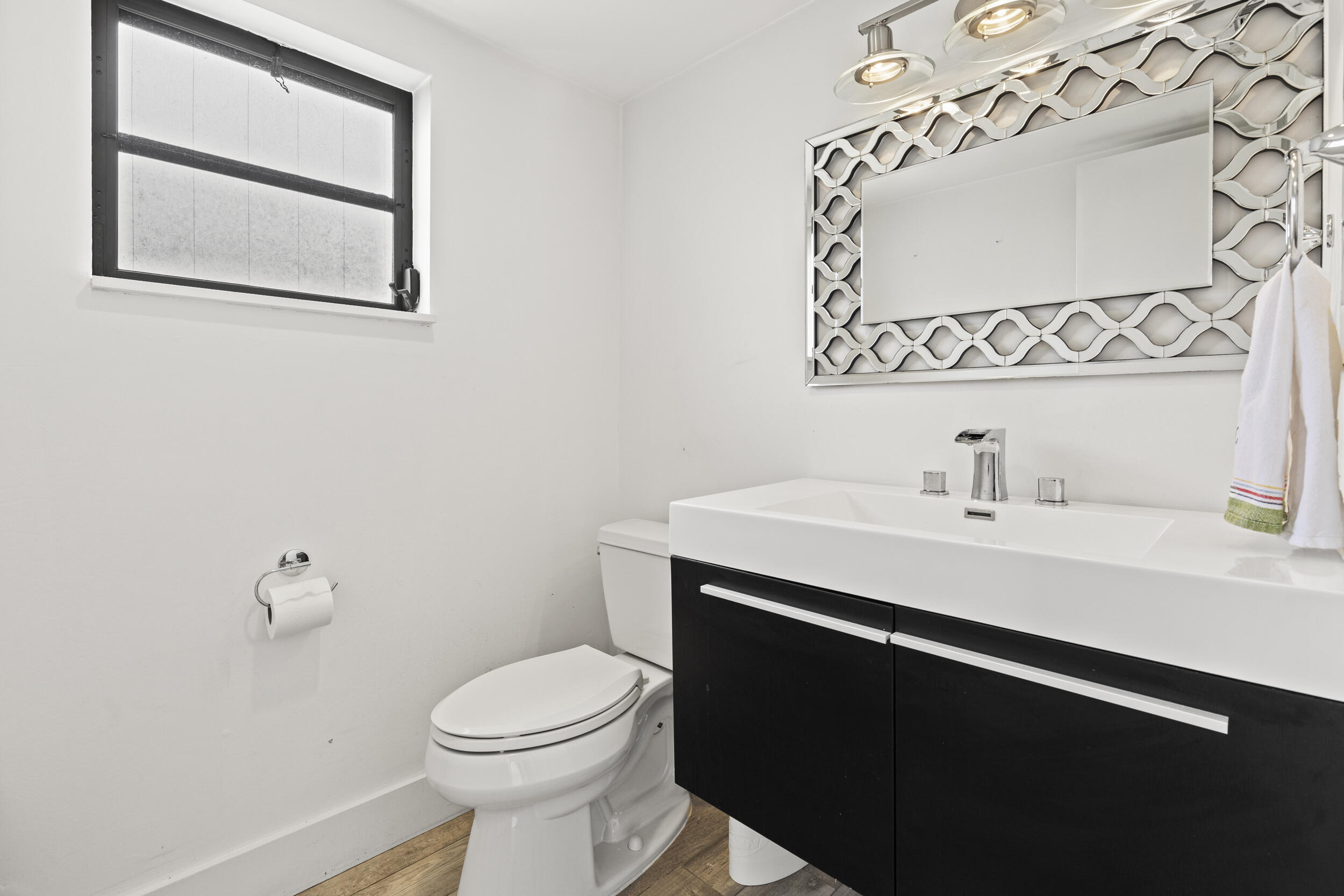 10718 Boca Woods Lane Boca Raton, FL 33428 - Photo 14 of 98 a bathroom with a sink mirror vanity and toilet