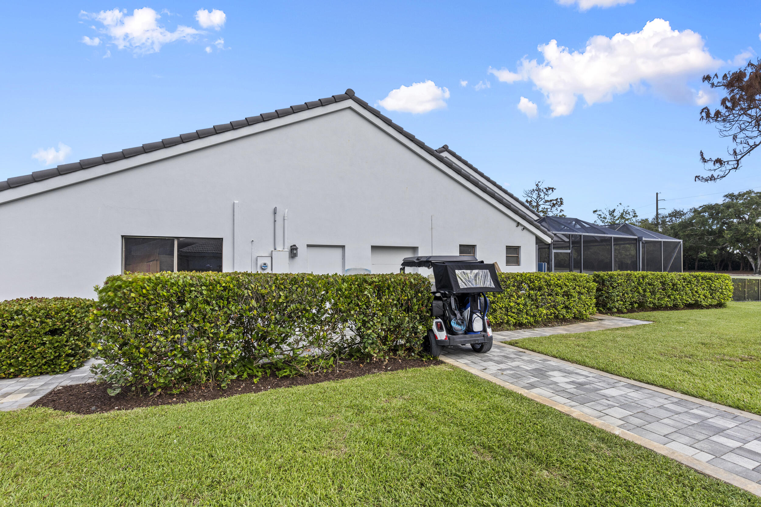 10718 Boca Woods Lane Boca Raton, FL 33428 - Photo 6 of 98 a front view of house with yard and green space