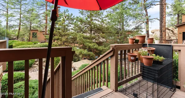 a view of a balcony with wooden floor