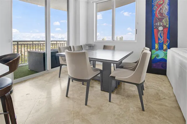 a dining room with furniture and wooden floor