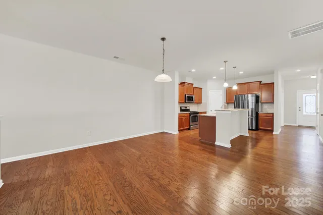 a view of kitchen with wooden floor
