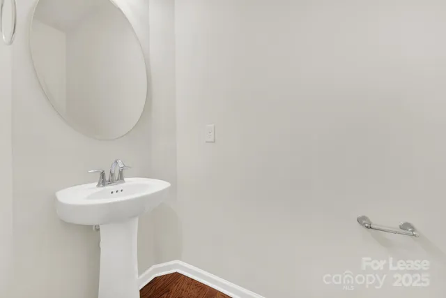 a bathroom with a sink a mirror and a shower