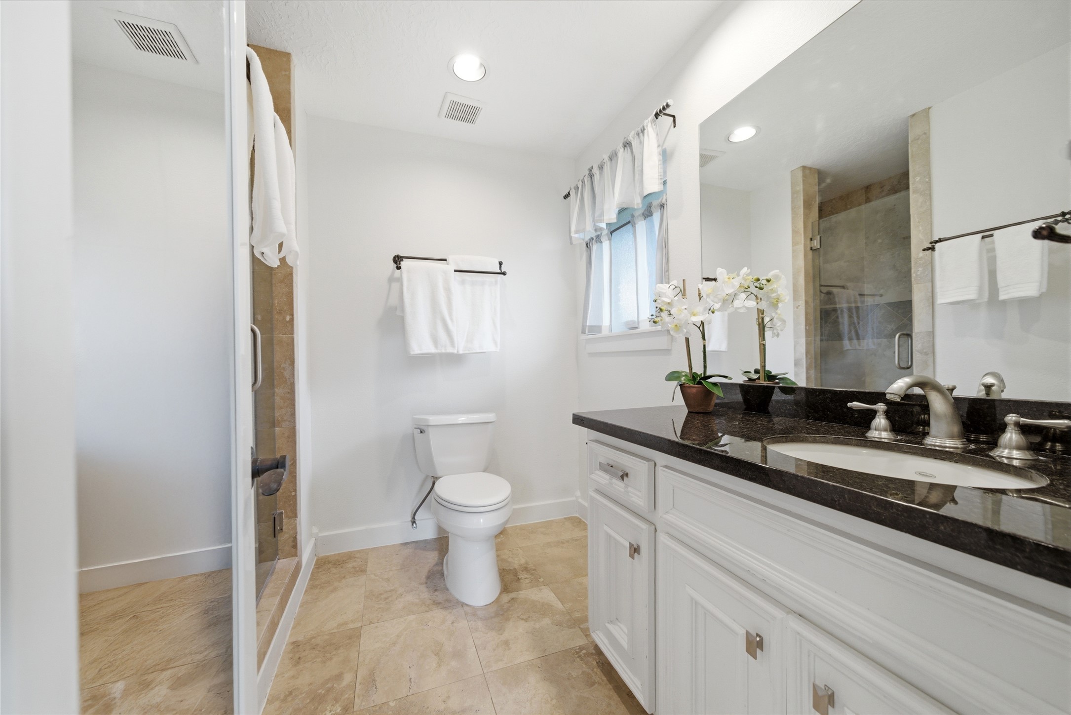 6427 Waltway Drive Houston, TX 77008 - Photo 26 of 37 Primary bathroom with walk-in shower with frameless glass door.