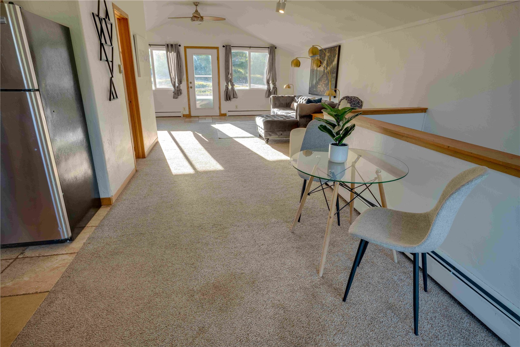 746 Edgewood Road Alma, CO 80420 - Photo 6 of 32 Carpeted dining space with a baseboard heating unit, ceiling fan, and lofted ceiling