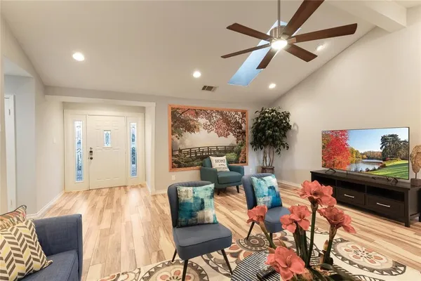 a living room with furniture and a flat screen tv