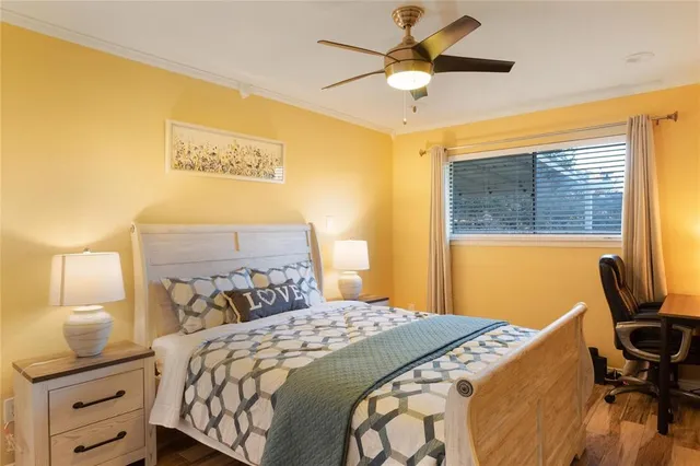 a bedroom with a bed and a desk