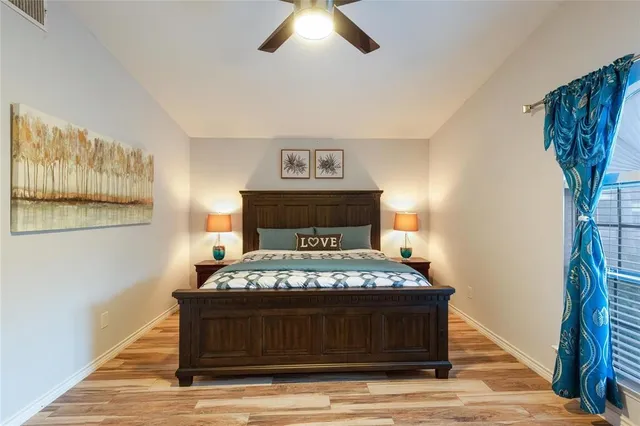 a bedroom with a bed and a table