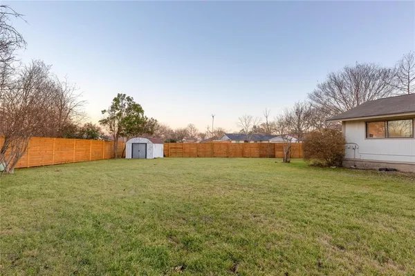 a yard with a house