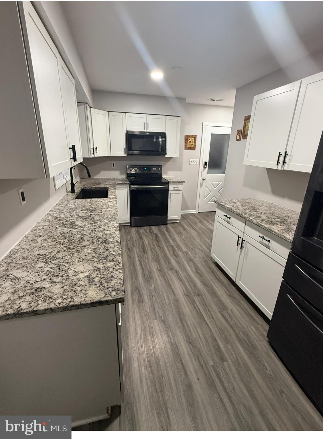 3102 Laurel Bush Road Abingdon, MD 21009 - Photo 6 of 28 a kitchen with stainless steel appliances granite countertop a stove and a sink