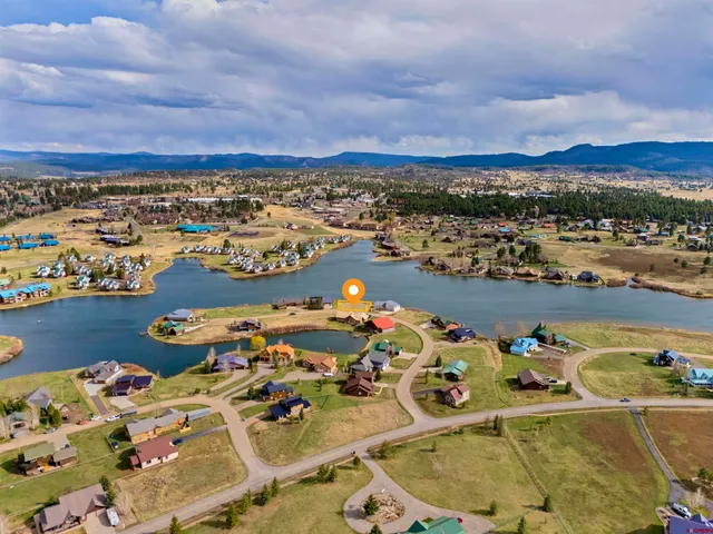 an aerial view of a house with a ocean view