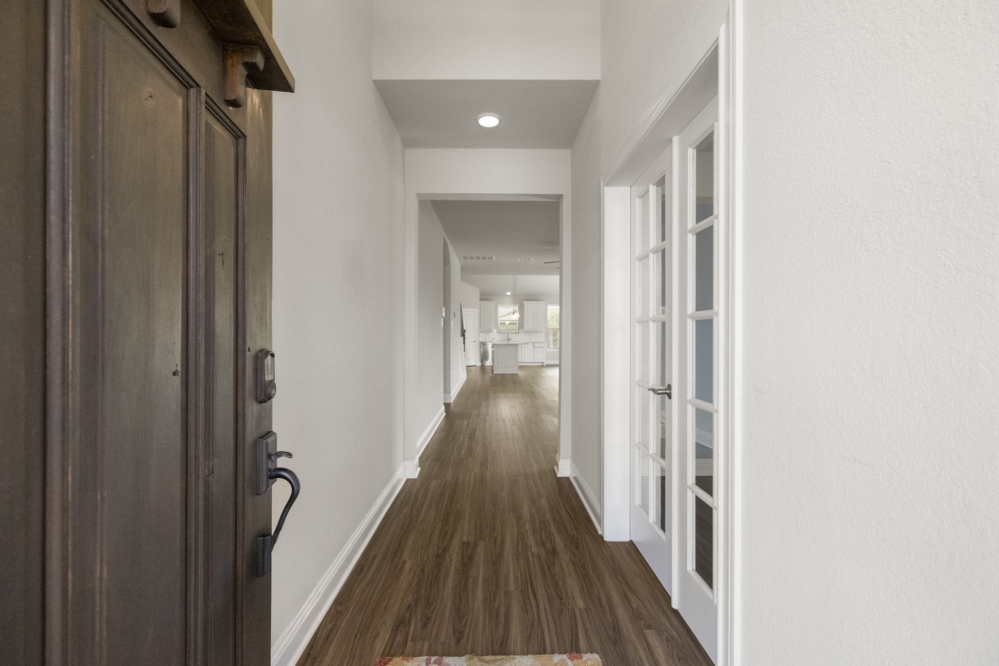 7502 Windsor Park Court Spring, TX 77379 - Photo 4 of 50 a view of a hallway with wooden floor and staircase