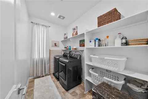 a storage room with a washer and dryer