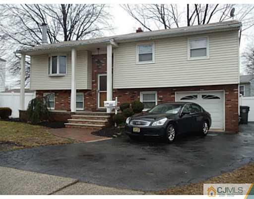 435 Crows Mill Road Fords, NJ 08863 - Photo 1 of 24 a car parked in front of a house