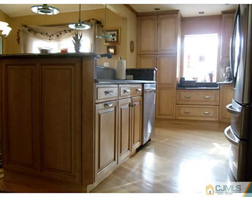 435 Crows Mill Road Fords, NJ 08863 - Photo 15 of 24 a kitchen with stainless steel appliances granite countertop a refrigerator and a stove