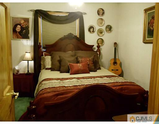 435 Crows Mill Road Fords, NJ 08863 - Photo 17 of 24 a bedroom with a bed and teddy bear on the floor
