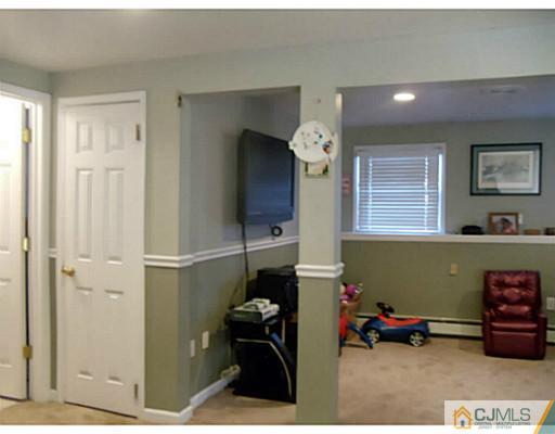 435 Crows Mill Road Fords, NJ 08863 - Photo 20 of 24 a living room with furniture and a window