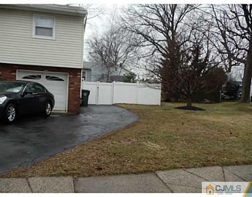 435 Crows Mill Road Fords, NJ 08863 - Photo 3 of 24 a view of a car parked in front of a house