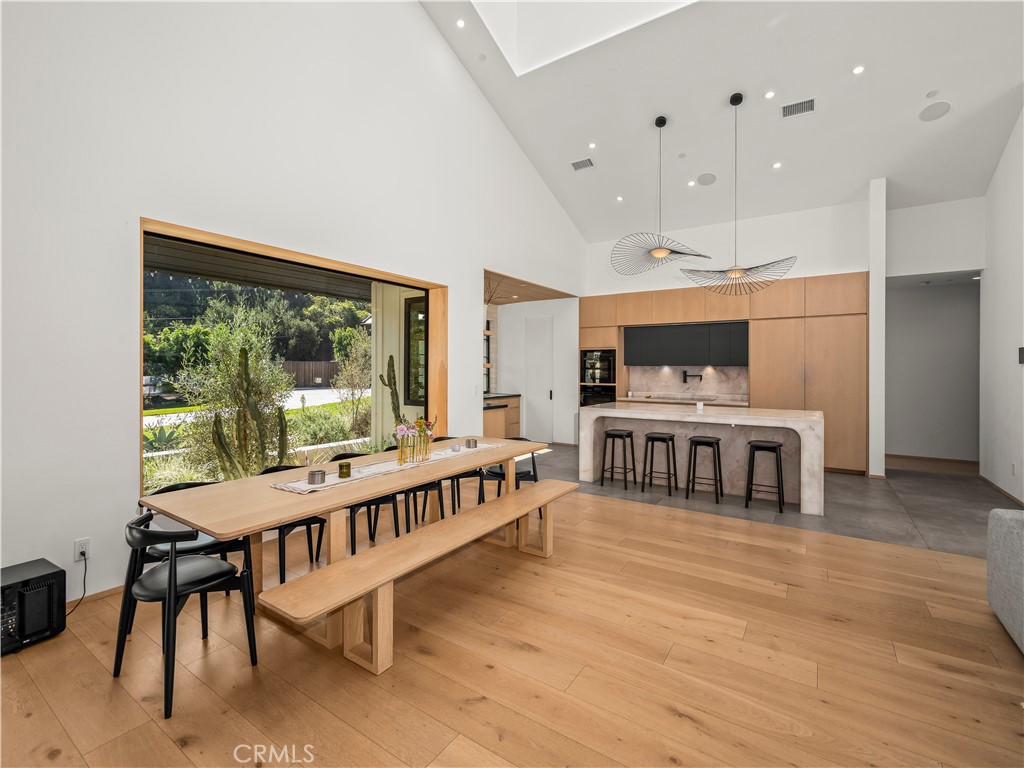 4874 Sun Valley Road Del Mar, CA 92014 - Photo 13 of 15 a large swimming pool with a large window and furniture