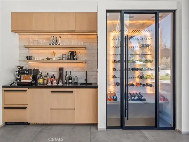 a kitchen with stainless steel appliances granite countertop a refrigerator and white cabinets