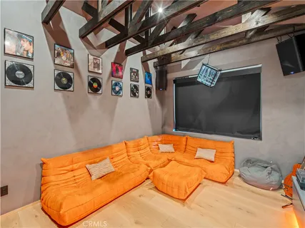 a bed room with a bed and a television