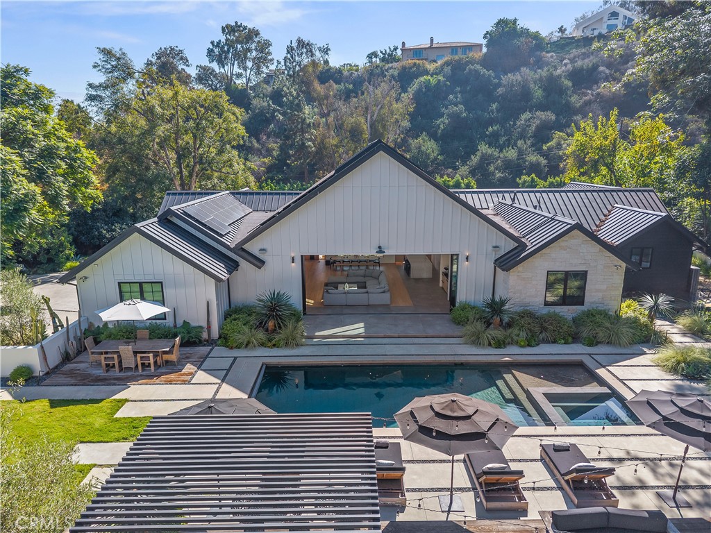 4874 Sun Valley Road Del Mar, CA 92014 - Photo 4 of 15 a view of a patio with couches table and chairs with wooden fence