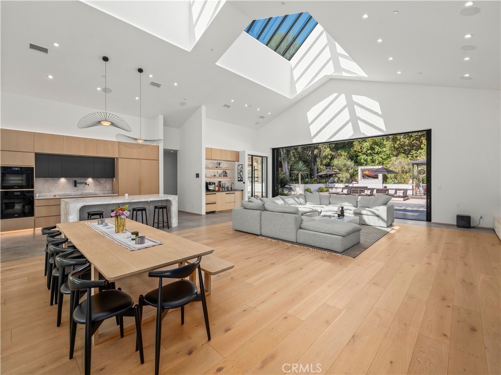 4874 Sun Valley Road Del Mar, CA 92014 - Photo 6 of 15 a living room with stainless steel appliances kitchen island furniture and a flat screen tv