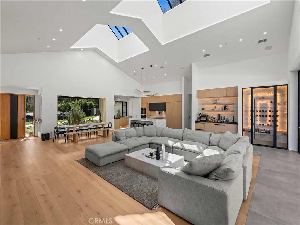 4874 Sun Valley Road Del Mar, CA 92014 - Photo 7 of 15 a living room with furniture and a flat screen tv