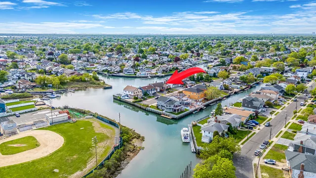 a view of living room kitchen with furniture and fireplace