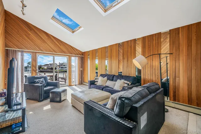 a dining room with furniture and a book shelf