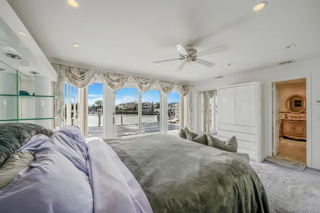 a bathroom with a glass shower door and a glass door