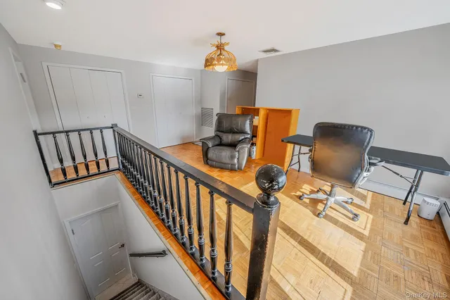 a bedroom with bed and white walls