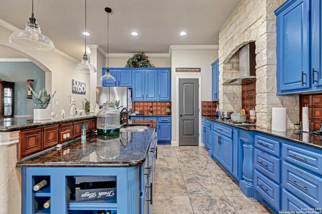 a kitchen with granite countertop lots of counter top space